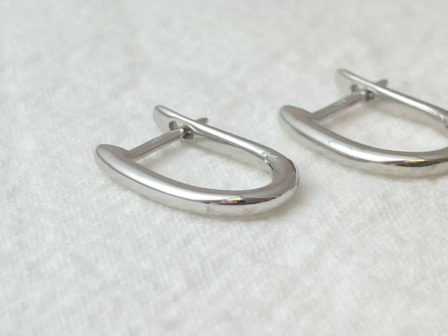 14K White Gold Oval Huggie Earrings