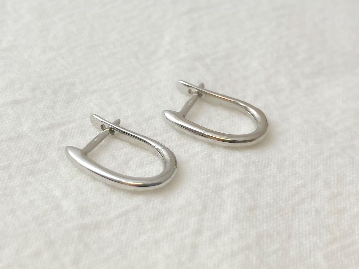 14K White Gold Oval Huggie Earrings
