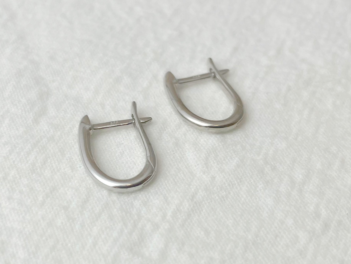 14K White Gold Oval Huggie Earrings