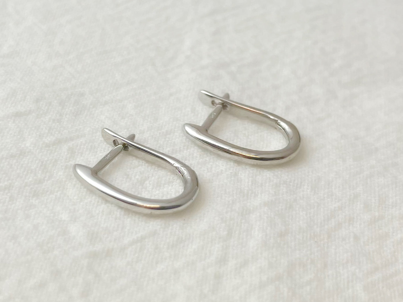 14K White Gold Oval Huggie Earrings