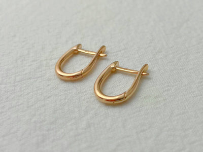 14K Rose Gold Oval Huggie Earrings
