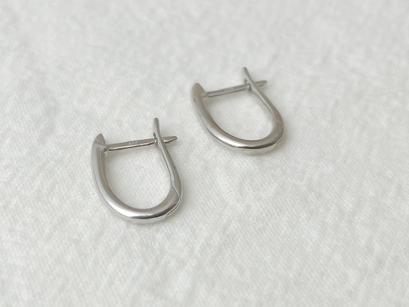 14K White Gold Oval Huggie Earrings